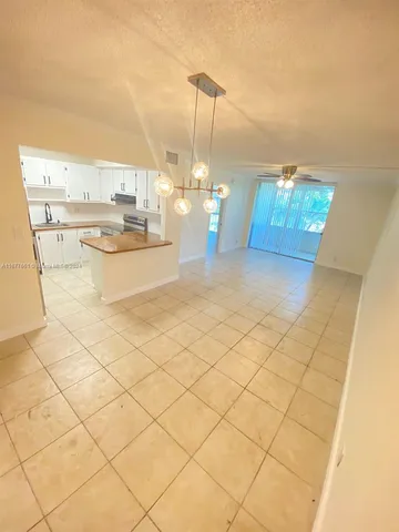 swimming pool view with a garden space
