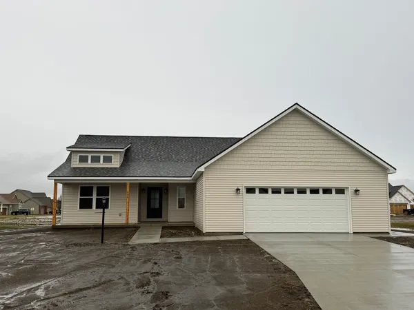 a front view of a house with a garage