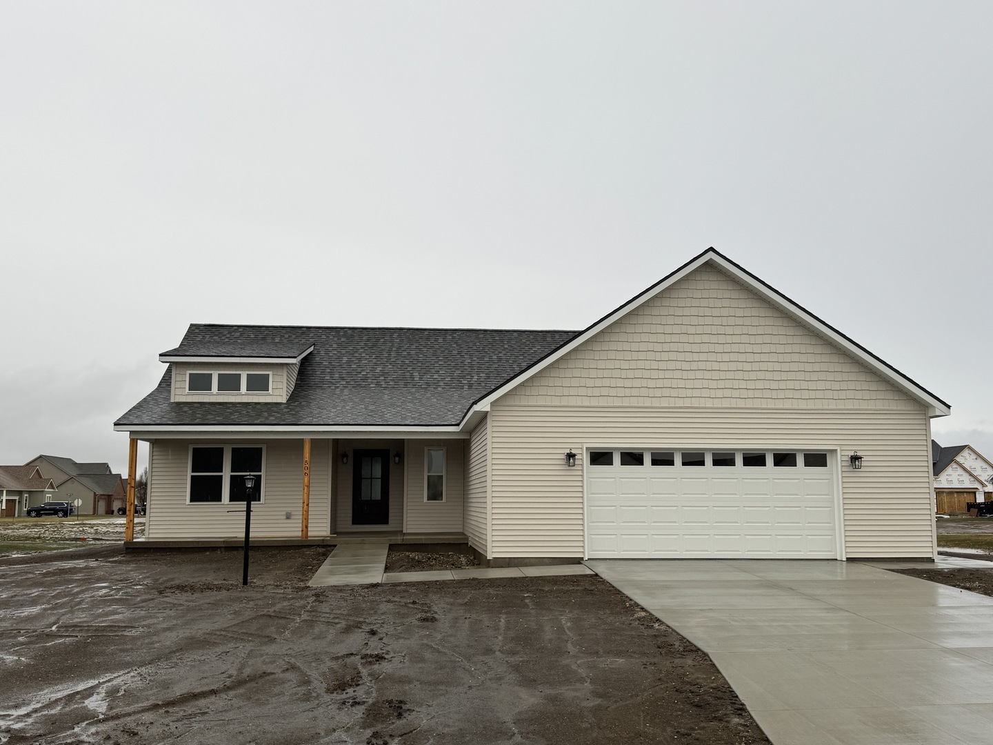 a front view of a house with a garage