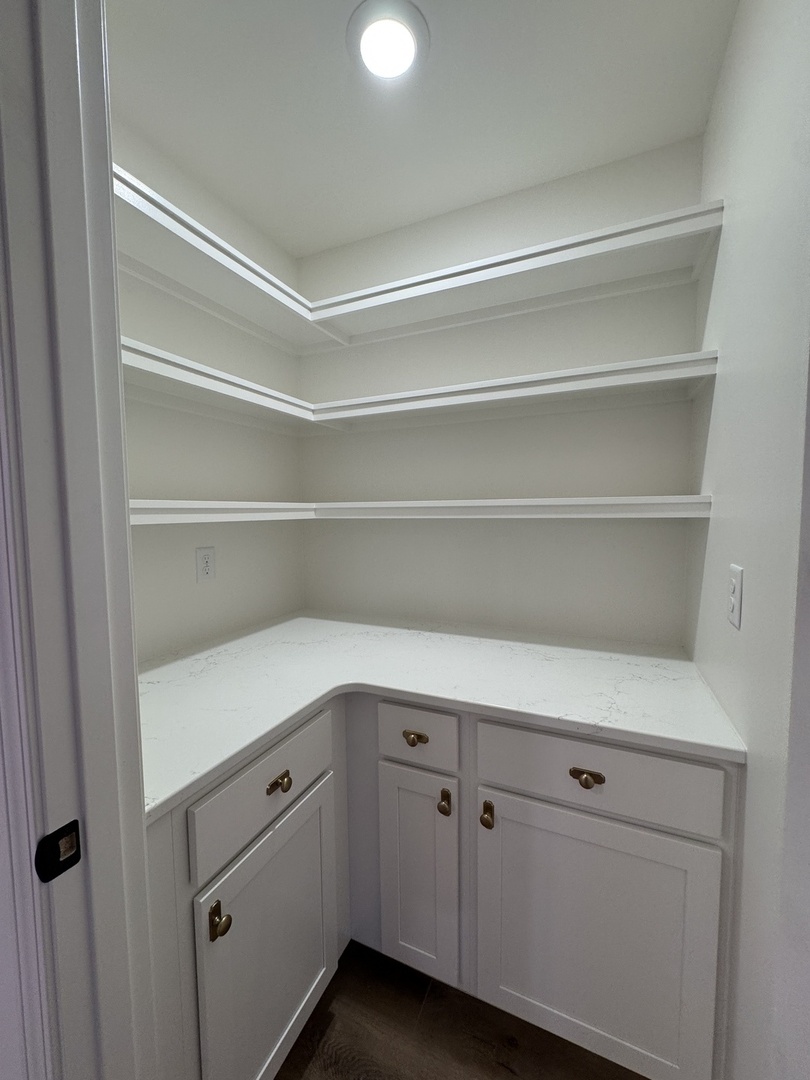506 Patterson Drive Bloomington, IL 61701 - Photo 11 of 28 a view of cabinets and utility room with empty racks