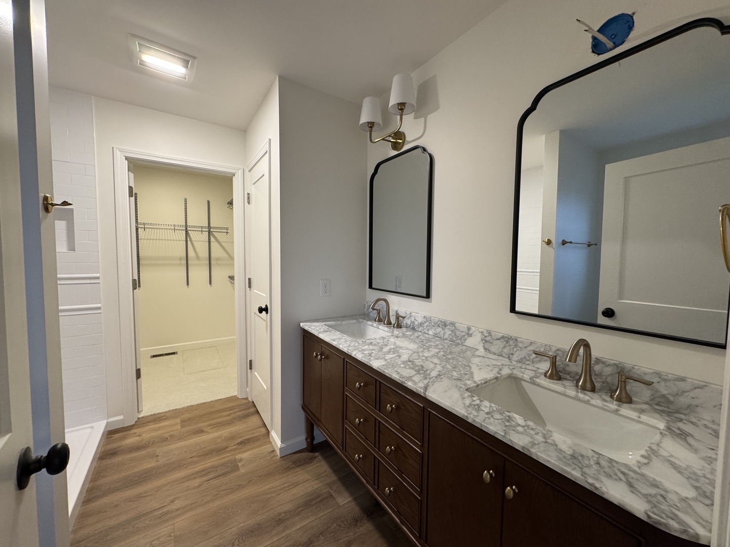 506 Patterson Drive Bloomington, IL 61701 - Photo 14 of 28 a en suite bathroom with double vanity sinks and a mirror