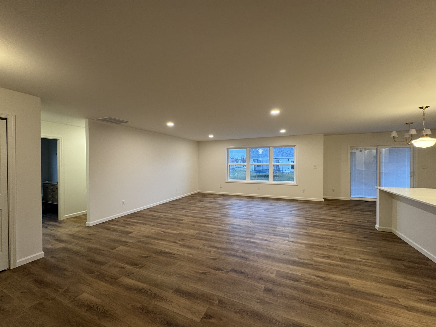 506 Patterson Drive Bloomington, IL 61701 - Photo 4 of 28 a view of empty room with wooden floor and fan