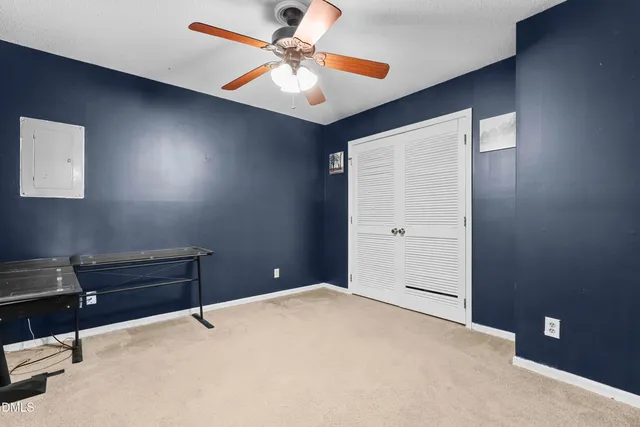 a view of a livingroom with a ceiling fan