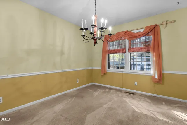 a view of a room with a chandelier