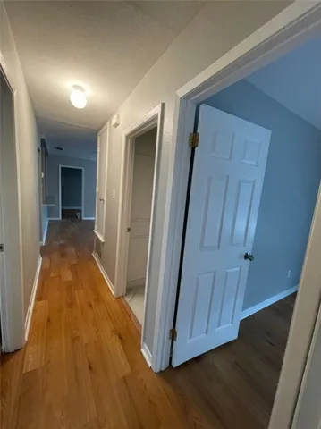 wooden floor in a hall with an entryway