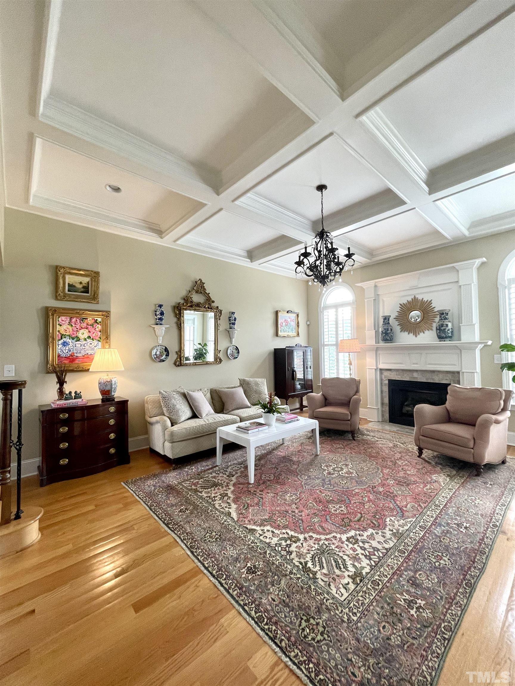 6228 Mitchell Mill Road Zebulon, NC 27597 - Photo 11 of 51 a living room with furniture and a chandelier