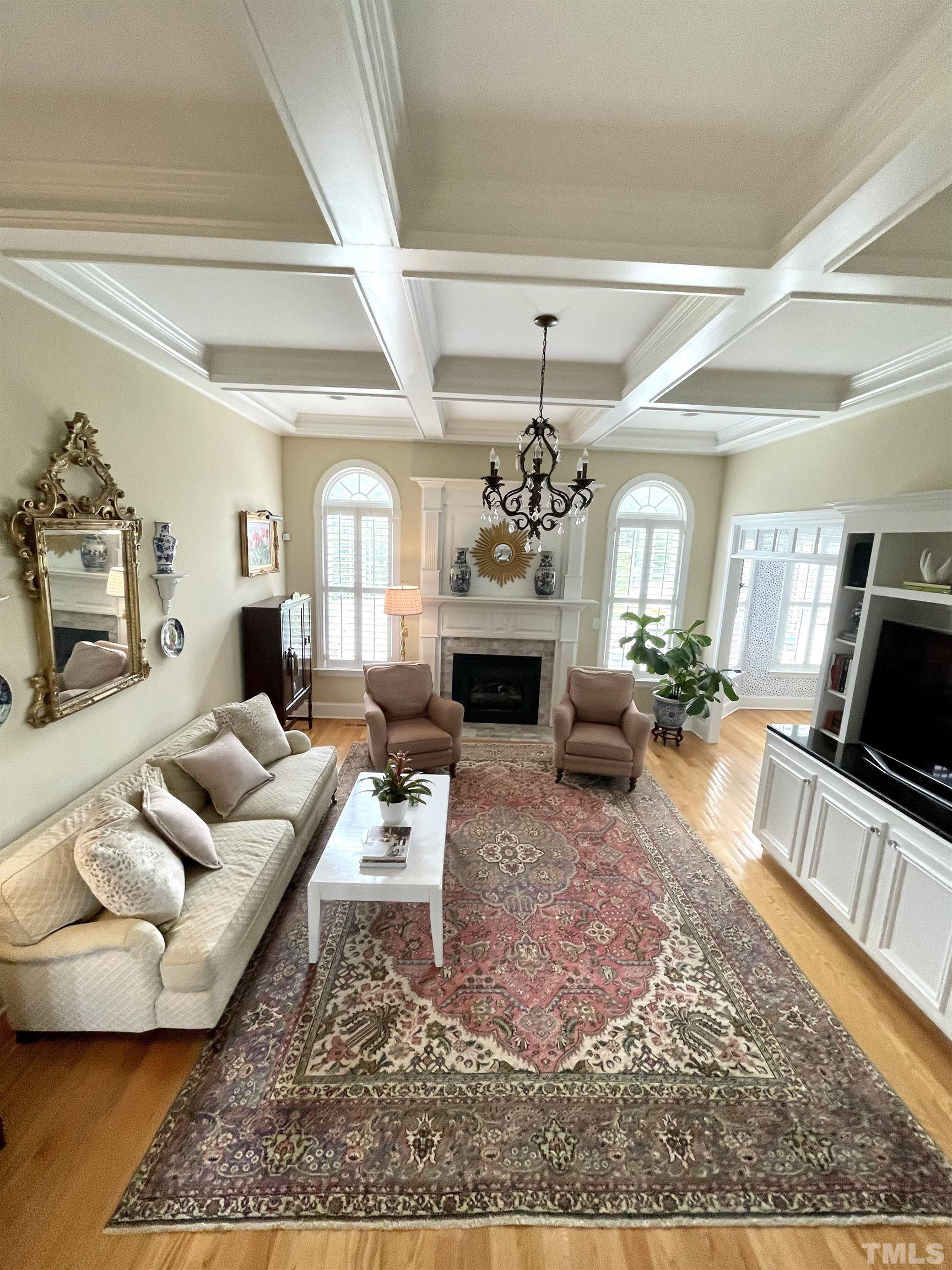 6228 Mitchell Mill Road Zebulon, NC 27597 - Photo 12 of 51 a living room with furniture a rug and a fireplace