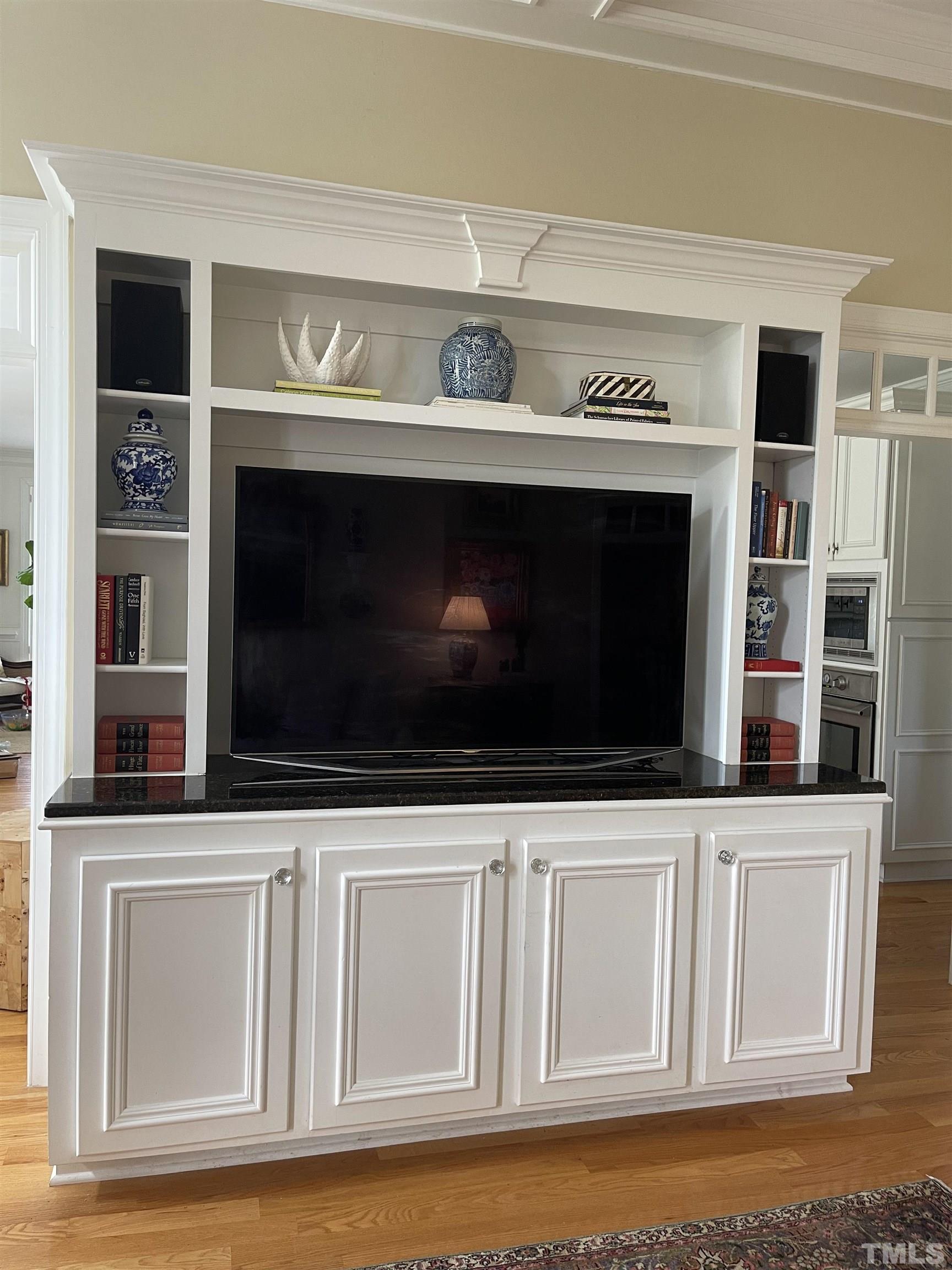 6228 Mitchell Mill Road Zebulon, NC 27597 - Photo 13 of 51 a kitchen with a stove and a microwave