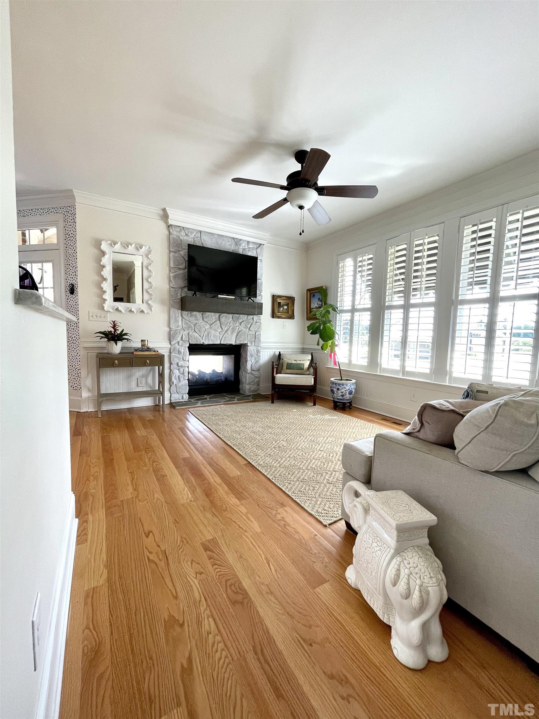6228 Mitchell Mill Road Zebulon, NC 27597 - Photo 14 of 51 a living room with furniture and a flat screen tv