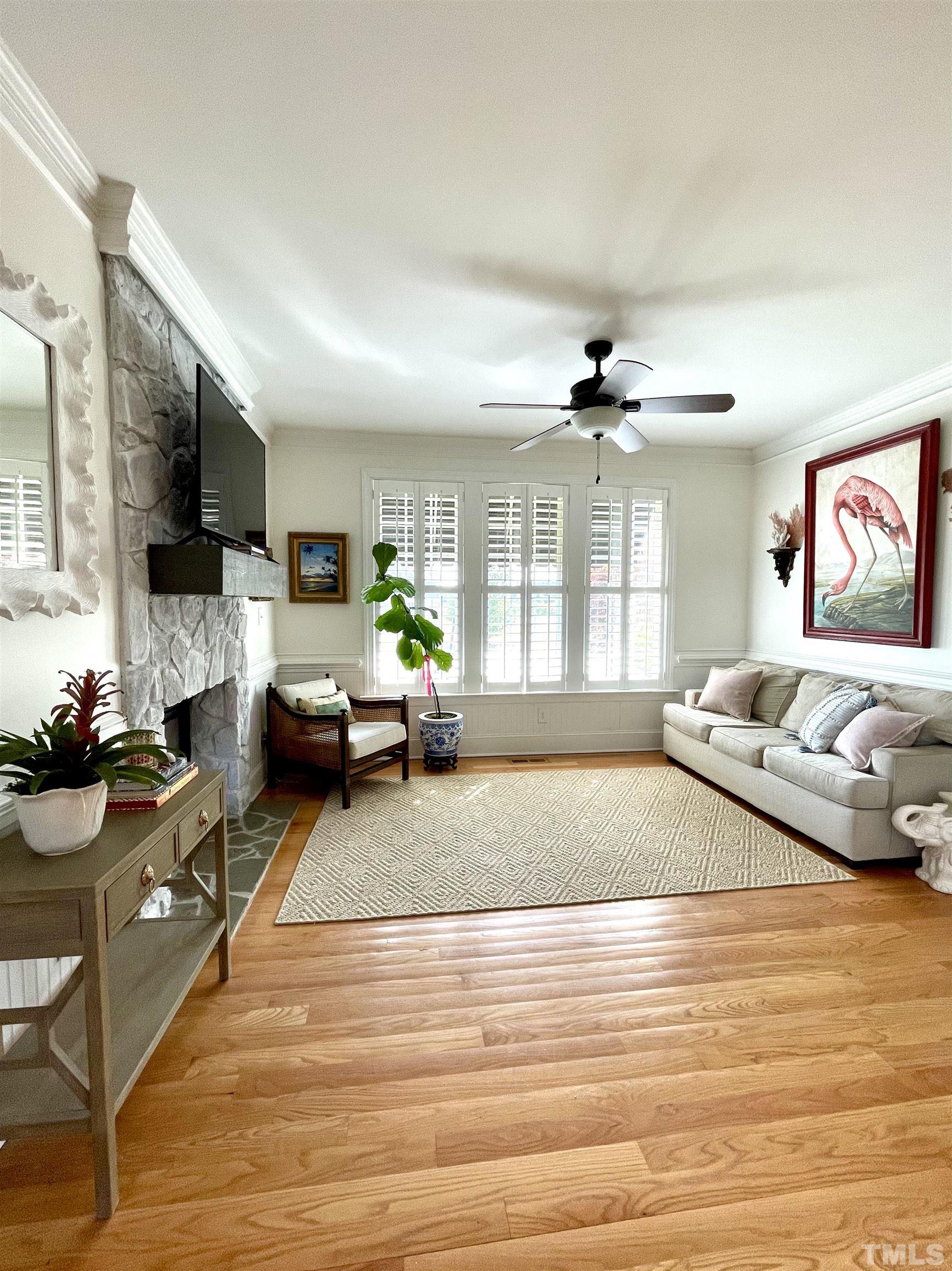 6228 Mitchell Mill Road Zebulon, NC 27597 - Photo 16 of 51 a living room with furniture window and wooden floor
