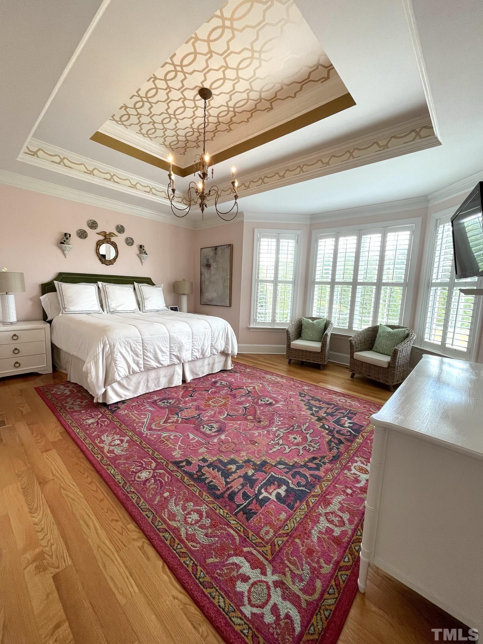 6228 Mitchell Mill Road Zebulon, NC 27597 - Photo 20 of 51 a bed sitting in a spacious bedroom next to a window