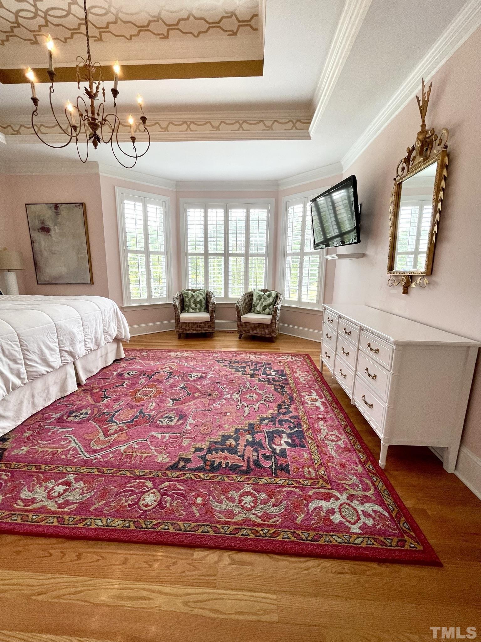 6228 Mitchell Mill Road Zebulon, NC 27597 - Photo 21 of 51 a bed sitting in a bedroom next to a window