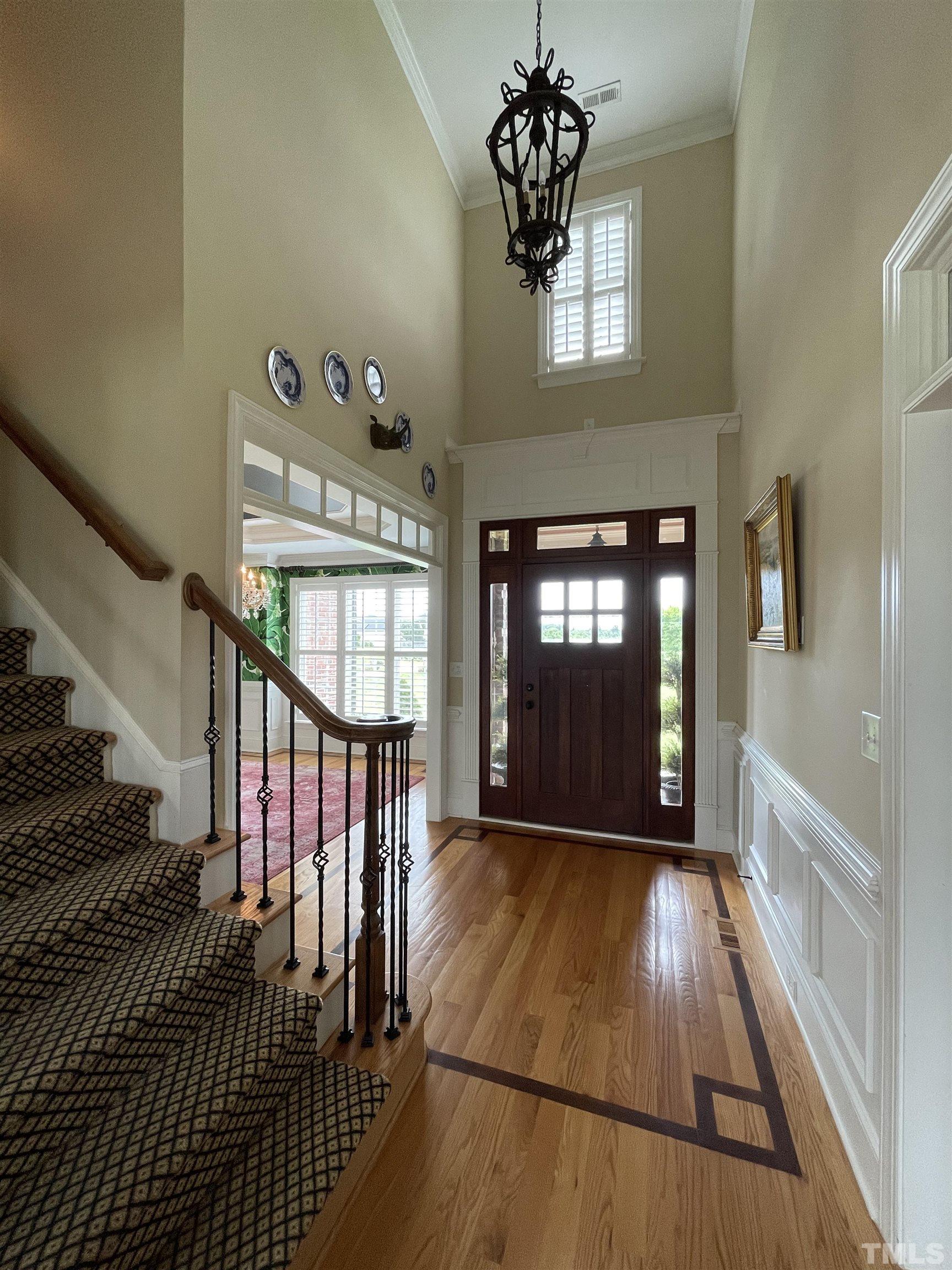 6228 Mitchell Mill Road Zebulon, NC 27597 - Photo 24 of 51 a view of entryway and hall with wooden floor