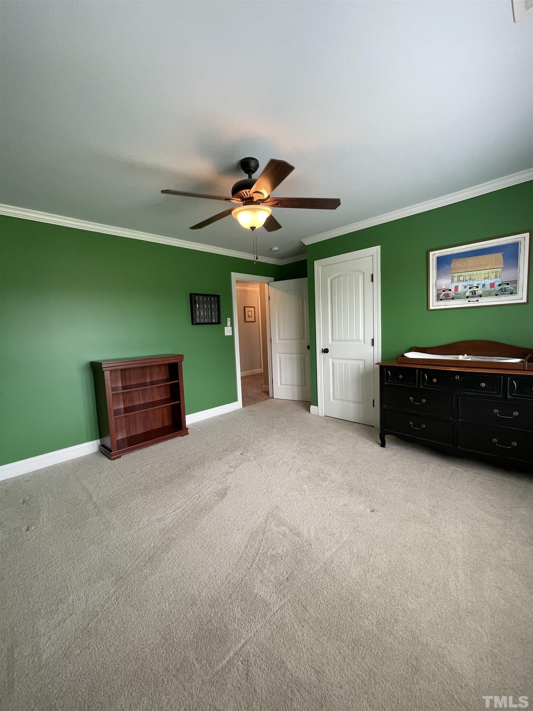 6228 Mitchell Mill Road Zebulon, NC 27597 - Photo 31 of 51 a living room with furniture and a ceiling fan