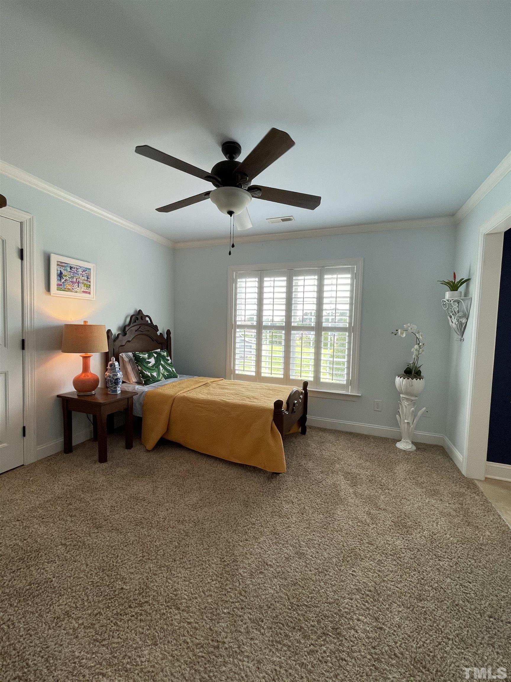6228 Mitchell Mill Road Zebulon, NC 27597 - Photo 37 of 51 a bed room with a bed and a window