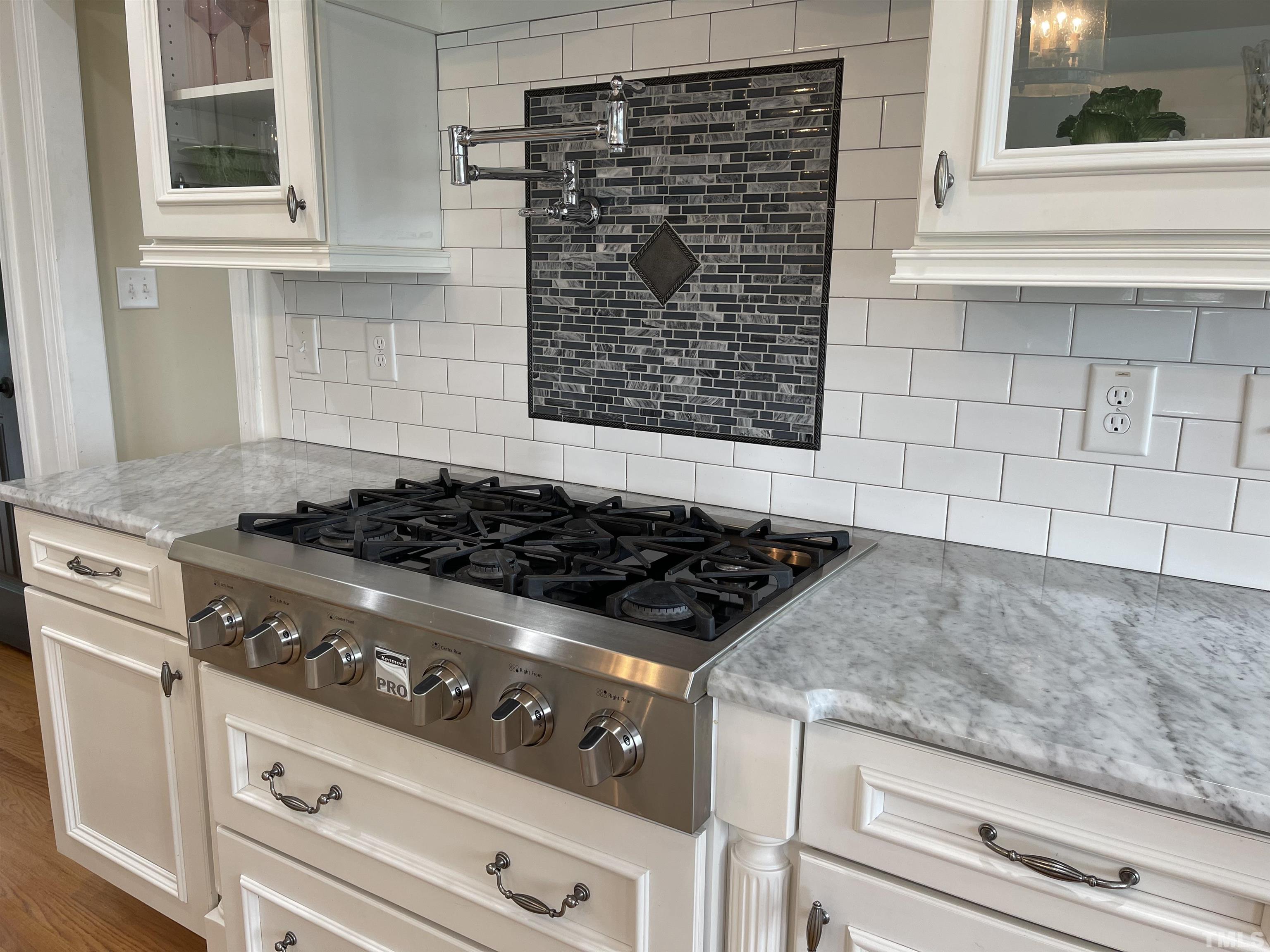 6228 Mitchell Mill Road Zebulon, NC 27597 - Photo 4 of 51 a stove top oven sitting inside of a kitchen