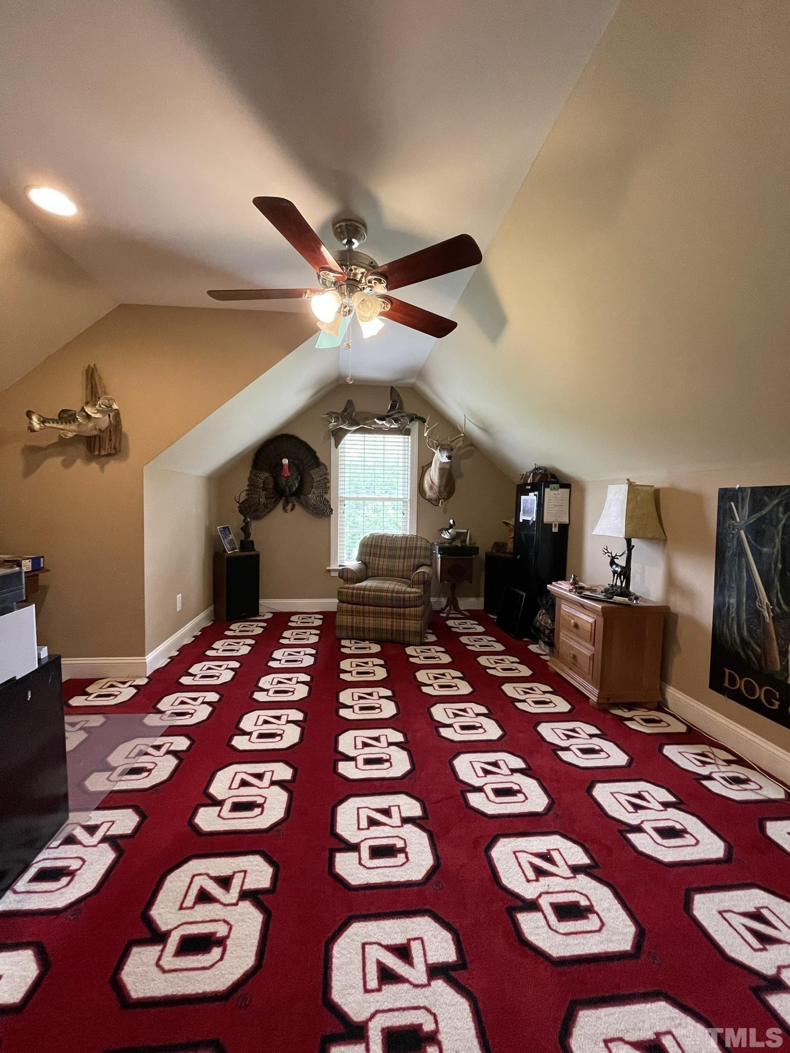 6228 Mitchell Mill Road Zebulon, NC 27597 - Photo 41 of 51 a bedroom with furniture and a rug