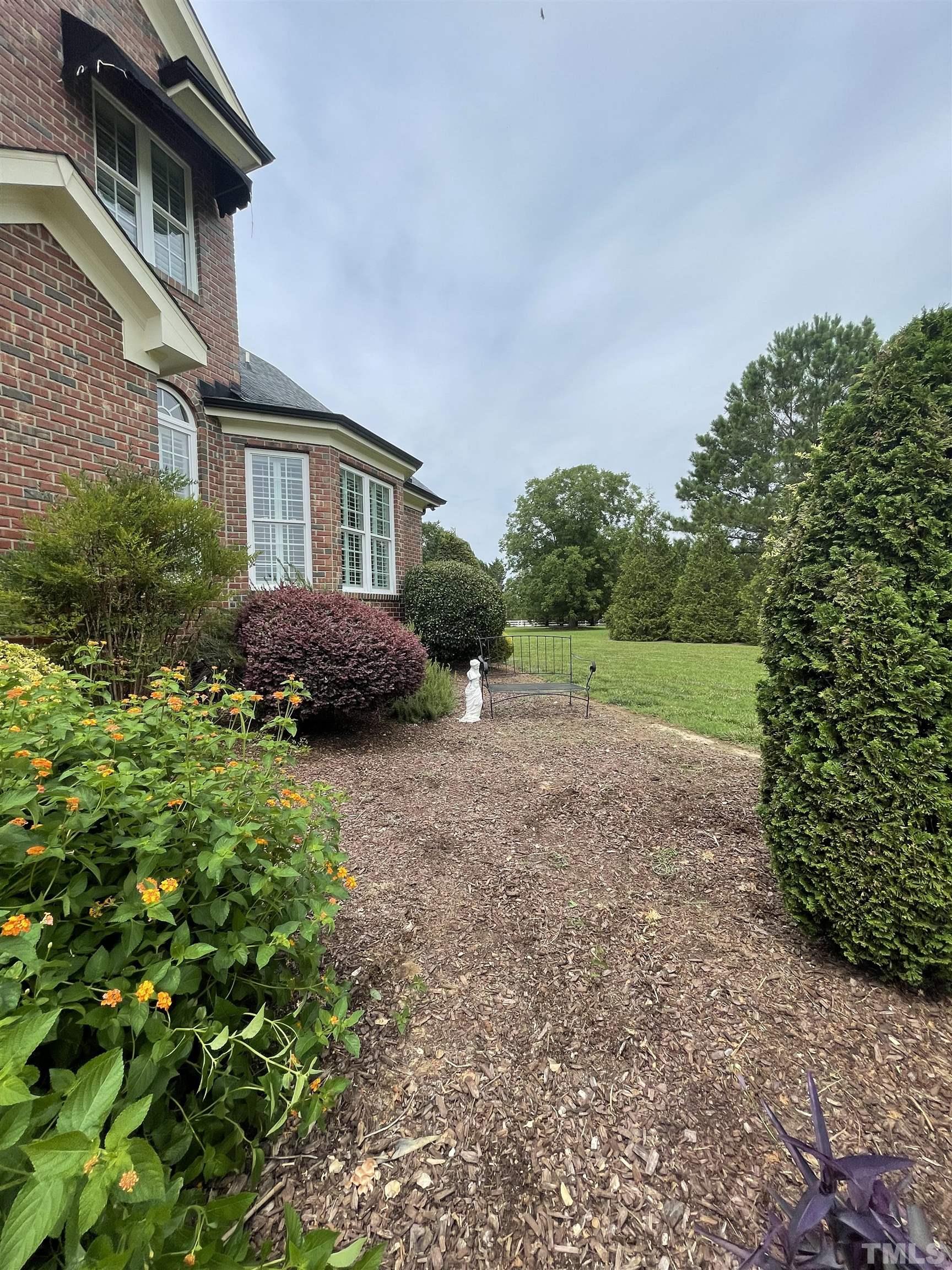 6228 Mitchell Mill Road Zebulon, NC 27597 - Photo 46 of 51 a front view of a house with a yard