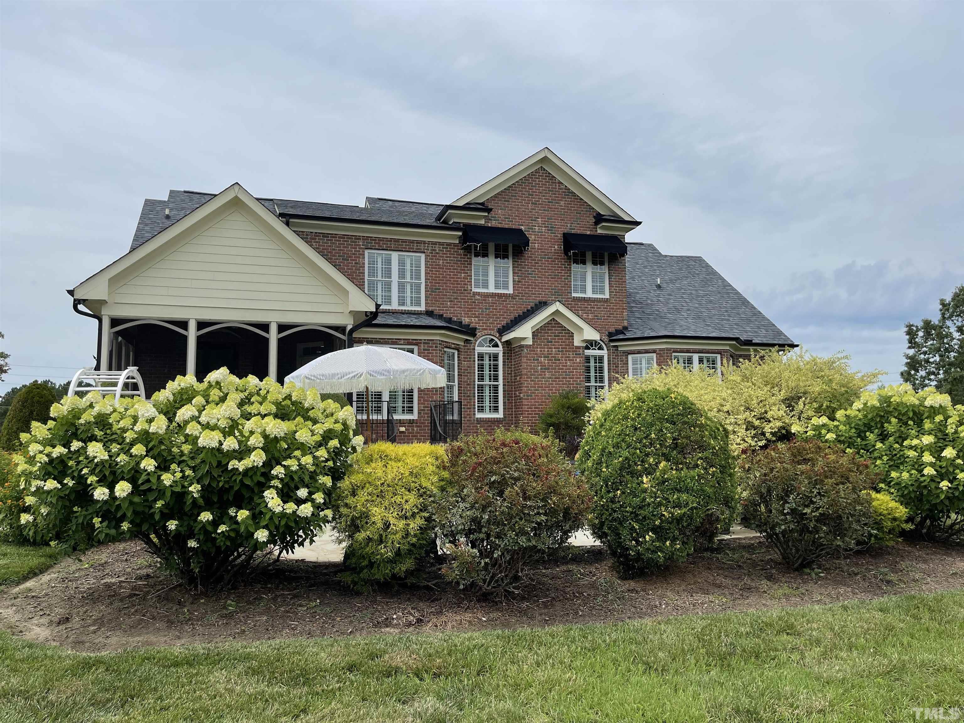 6228 Mitchell Mill Road Zebulon, NC 27597 - Photo 49 of 51 front view of a house with a yard