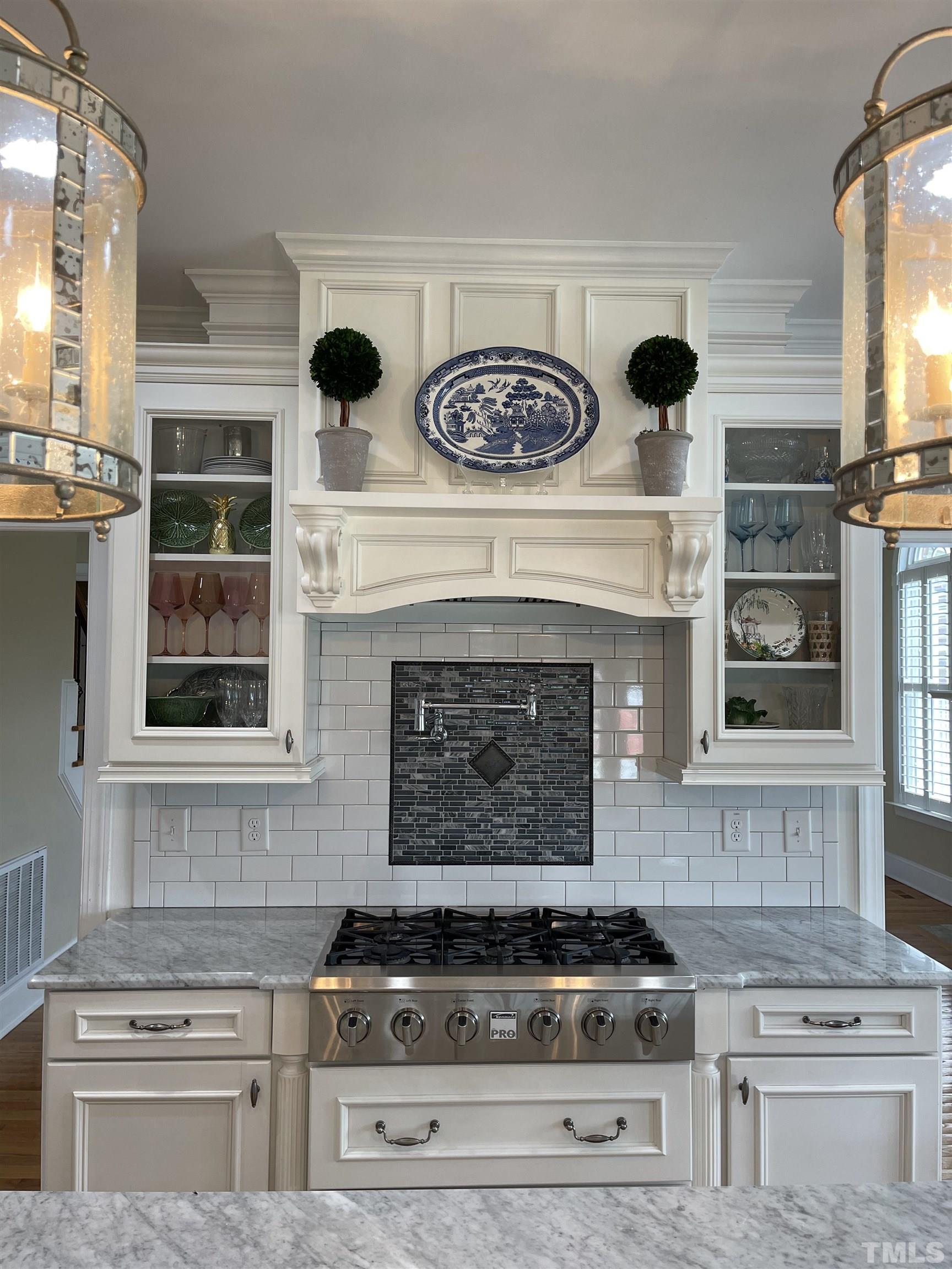 6228 Mitchell Mill Road Zebulon, NC 27597 - Photo 5 of 51 a stove top oven sitting inside of a kitchen