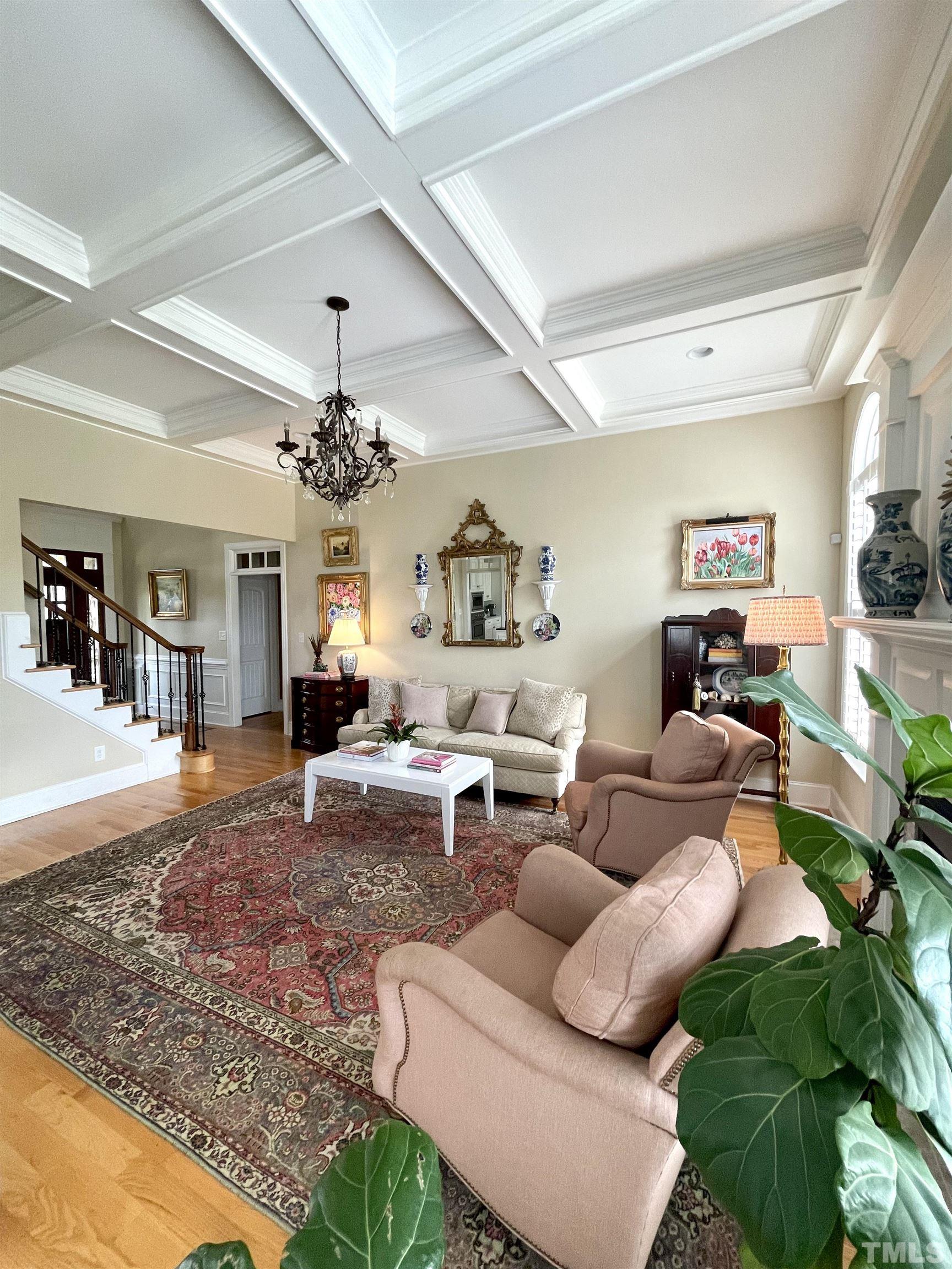 6228 Mitchell Mill Road Zebulon, NC 27597 - Photo 10 of 51 a living room with furniture and a chandelier