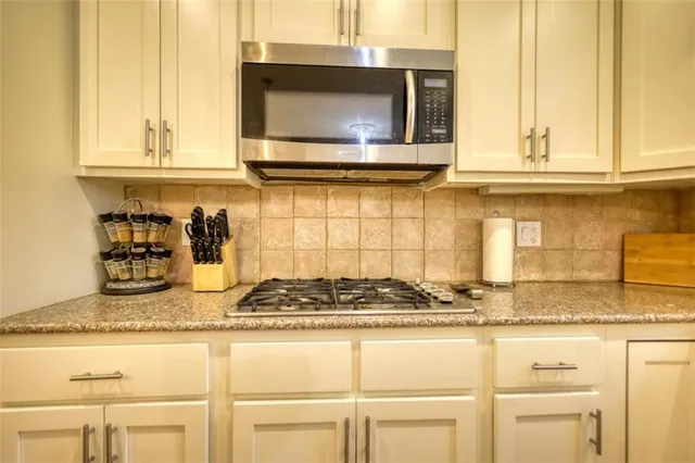 a view of a livingroom with furniture window and wooden floor