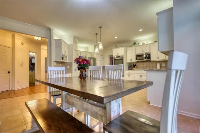 a spacious bedroom with a large bed and a large window