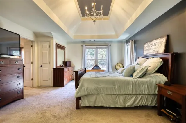 a bathroom with a sink toilet a mirror and shower