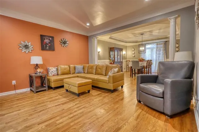 a dining room with furniture and wooden floor