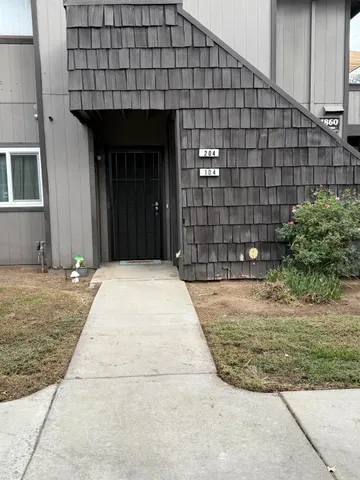 a house view with a backyard space