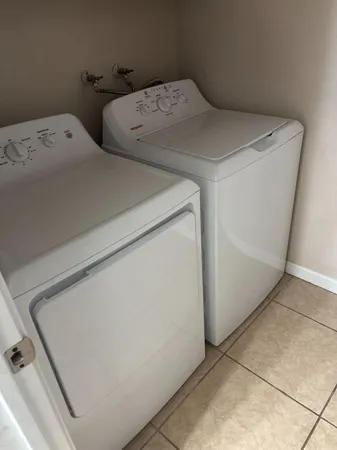 a utility room with dryer and washer