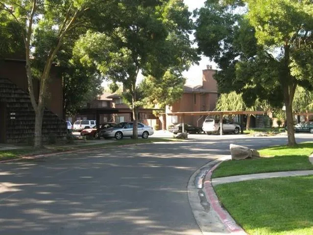 a view of street with houses and trees