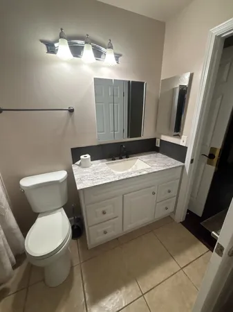 a kitchen with a sink and a refrigerator