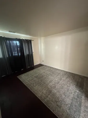 a kitchen with a refrigerator and a stove top oven