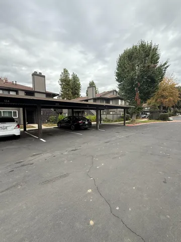 a view of street with cars parked