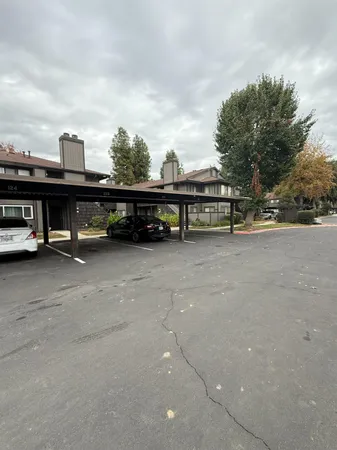a view of street with cars parked