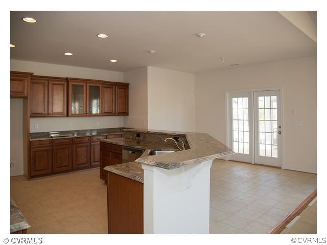1246 Coalfield Road Midlothian, VA 23114 - Photo 2 of 5 a kitchen with a stove and a microwave