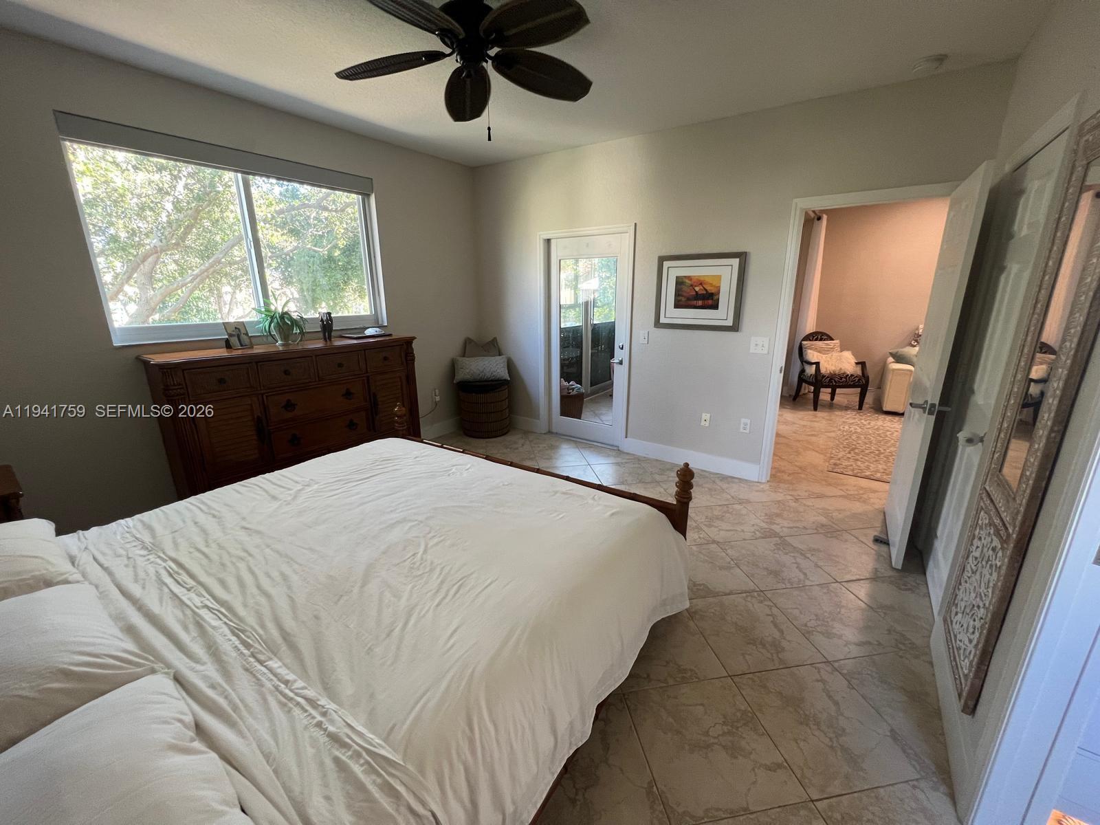 75 Gulfstream Road, Unit 211B Dania Beach, FL 33004 - Photo 14 of 57 a bedroom with a bed and a large window