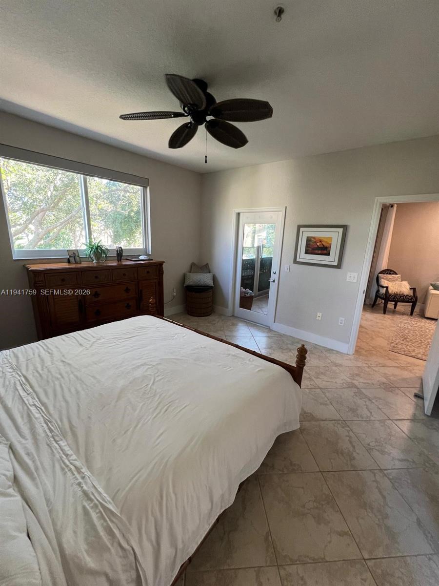 75 Gulfstream Road, Unit 211B Dania Beach, FL 33004 - Photo 15 of 57 a bedroom with a bed and window