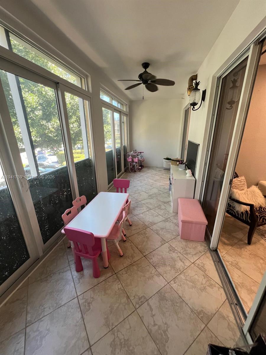 75 Gulfstream Road, Unit 211B Dania Beach, FL 33004 - Photo 21 of 57 a room with patio furniture