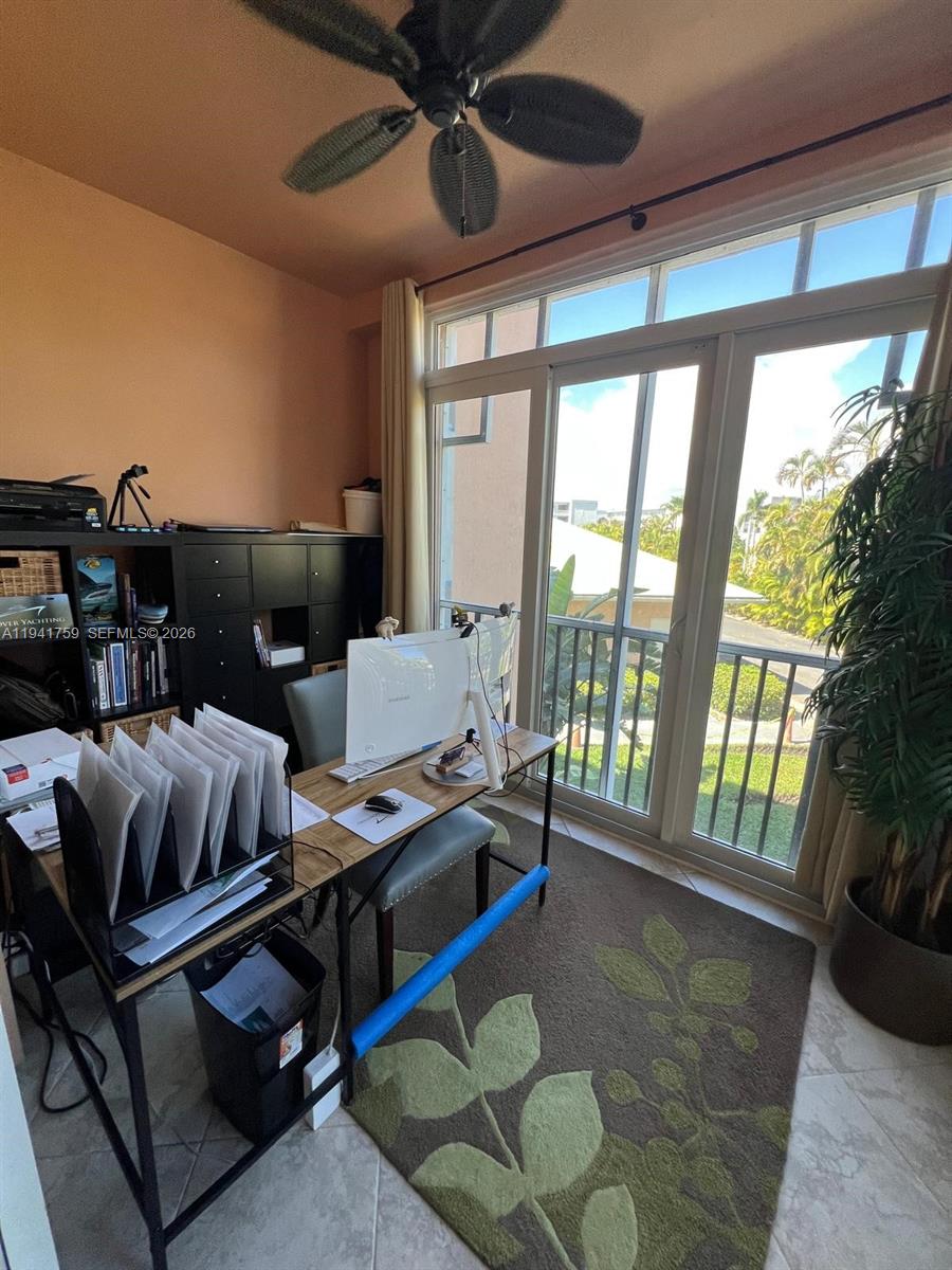 75 Gulfstream Road, Unit 211B Dania Beach, FL 33004 - Photo 34 of 57 a bedroom with furniture and a large window