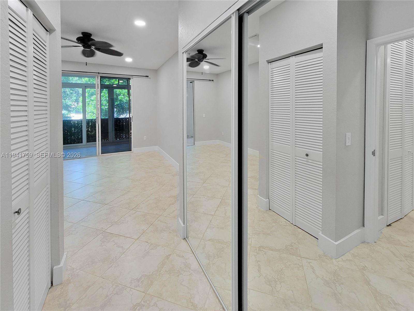 75 Gulfstream Road, Unit 211B Dania Beach, FL 33004 - Photo 48 of 57 a view of a big room with windows and chandelier