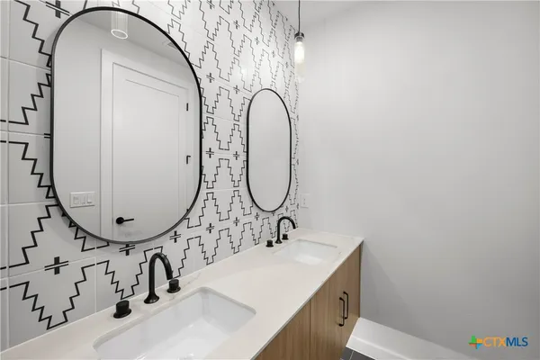 a bathroom with a sink and a mirror