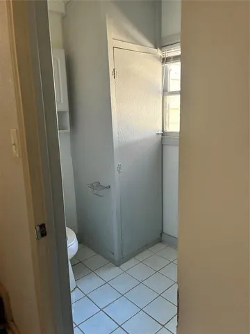 a bathroom with a glass door shower