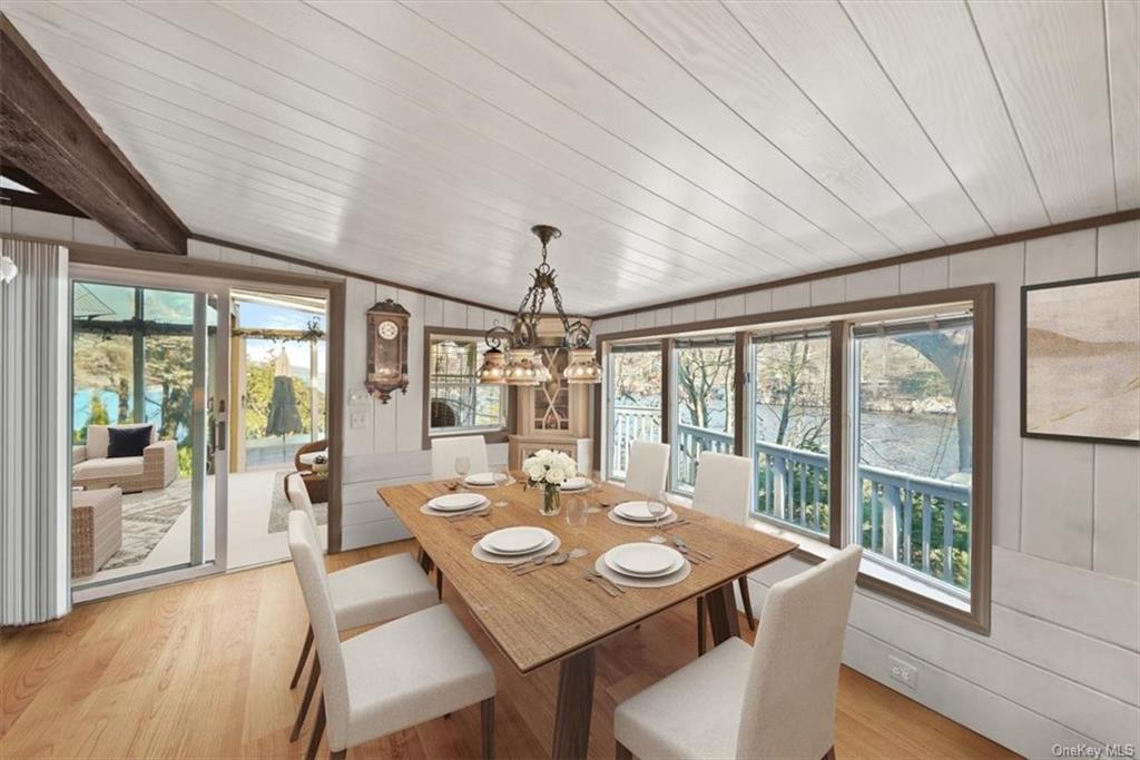 44 Cove Road Warwick, NY 10990 - Photo 9 of 22 a view of a dining room with furniture large windows and wooden floor