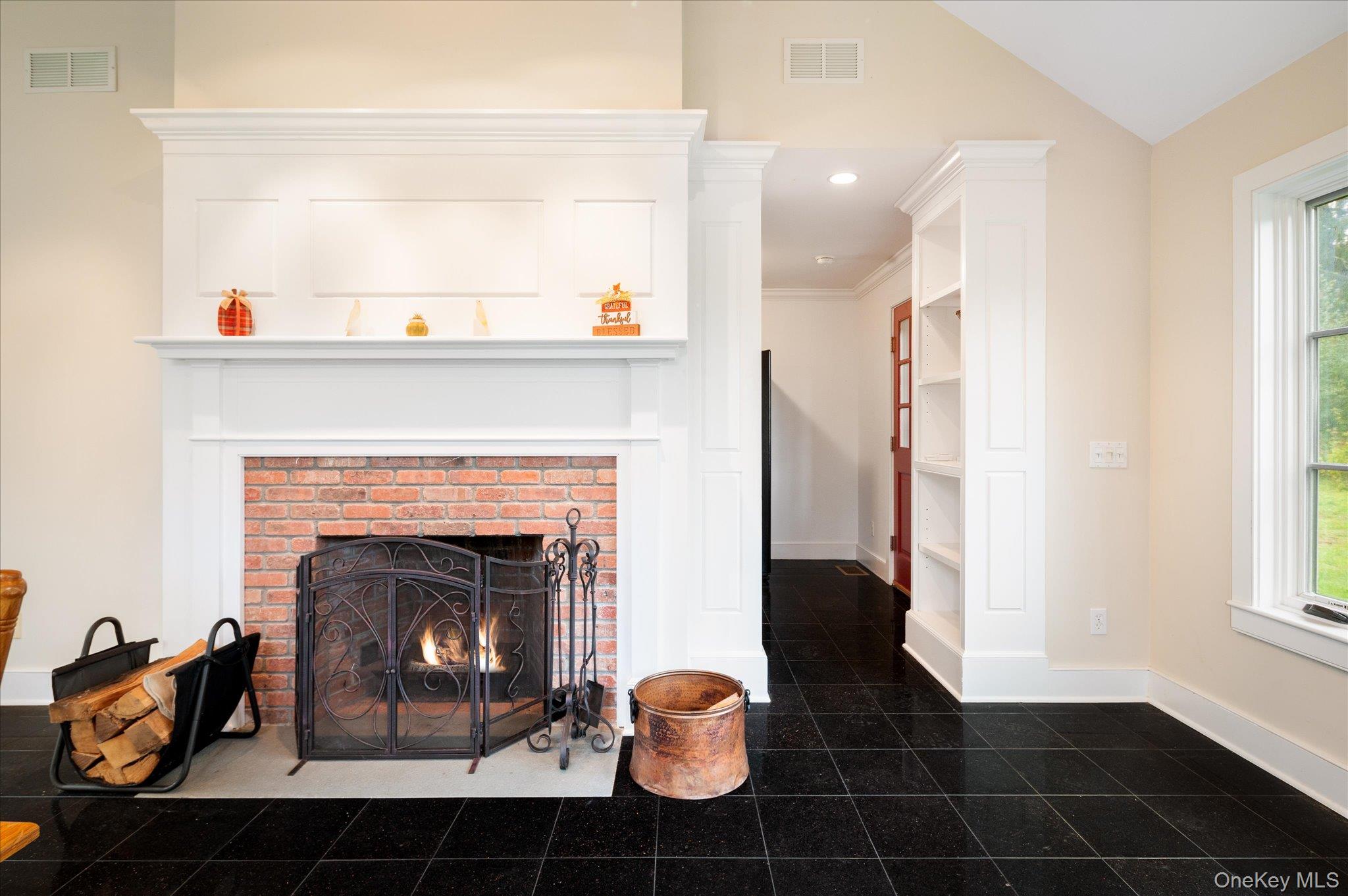 1 Hoyt Road Wingdale, NY 12594 - Photo 30 of 44 A striking brick fireplace framed in detailed millwork anchors the space with warmth.