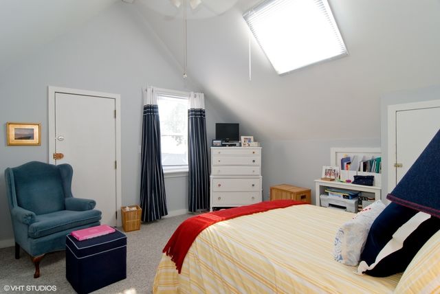 a bedroom with bed and a couch