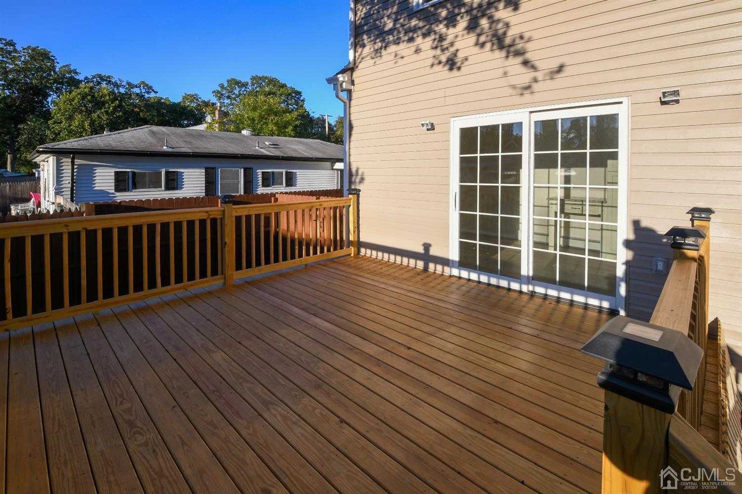 15 Brookside Road Spotswood, NJ 08884 - Photo 40 of 42 a view of a house with wooden deck
