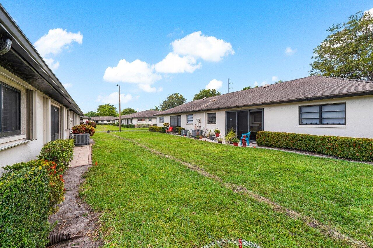 4895 Equestrian Circle, Unit B Boynton Beach, FL 33436 - Photo 19 of 31 Exterior Rear