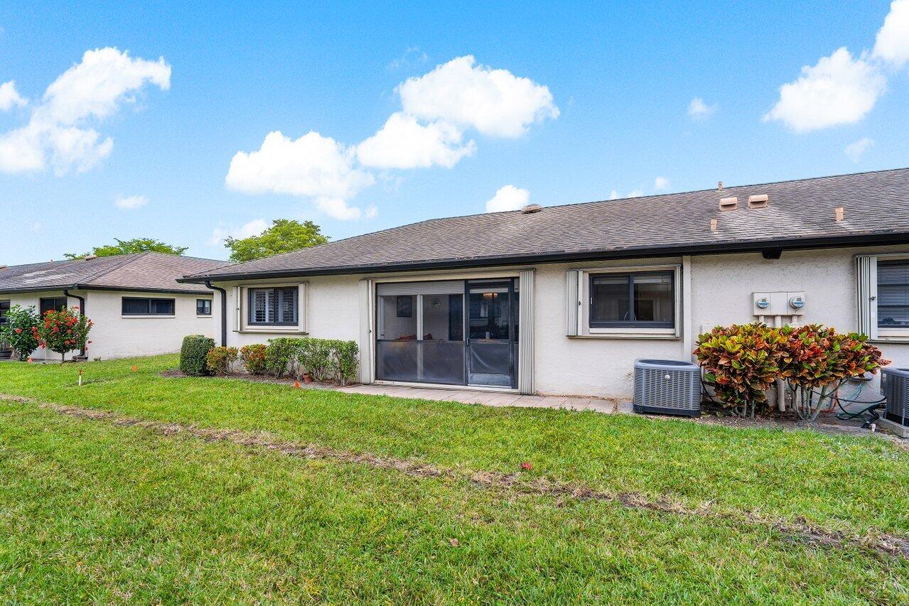 4895 Equestrian Circle, Unit B Boynton Beach, FL 33436 - Photo 21 of 31 Exterior Rear